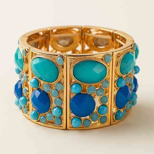 brazlete Harmonia Brazalete Harmonía elástico con piezas símil piedra en tonos azul turquesa y azul klein sobre base dorada.