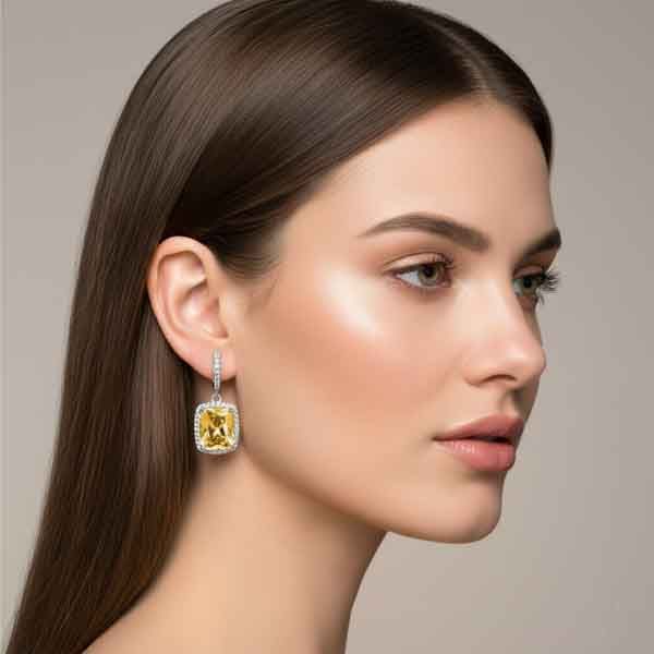 modelo con pendientes Euria plata con circonita paparadscha de Luxenter