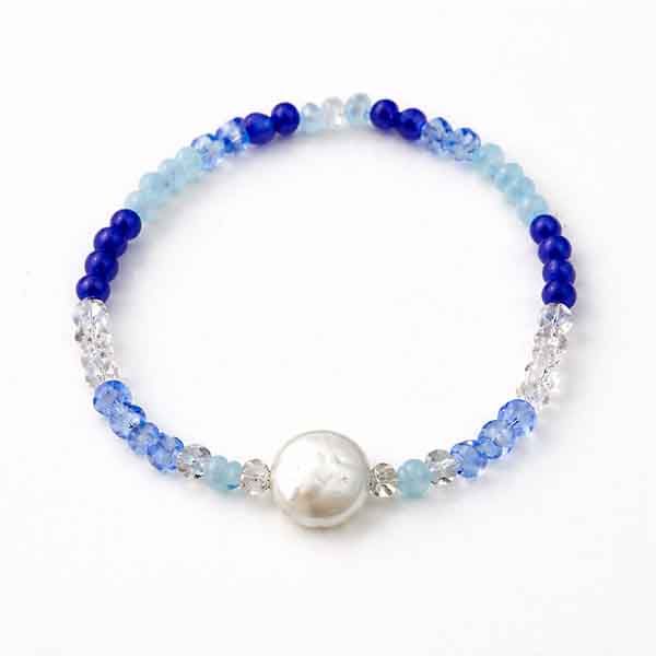 Pulsera azul con perla Océano – diseño artesanal Pulsera azul con perla Océano artesanal hecha a mano
