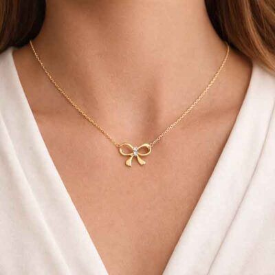 collar lazo dorado plata con circonitas blancas en mujer